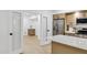 Bright kitchen with stainless appliances, wood cabinets, and an adjacent sink area at 2774 E Valencia St, Gilbert, AZ 85296