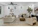 Bright living room features neutral tones, light wood floors, and stylish décor at 2774 E Valencia St, Gilbert, AZ 85296