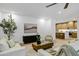 Bright living room with light wood floors, stylish décor, and a modern kitchen at 2774 E Valencia St, Gilbert, AZ 85296