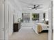 Serene bedroom features neutral carpet, ceiling fan, and large bright windows at 2774 E Valencia St, Gilbert, AZ 85296