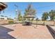 Backyard patio featuring a brick surface, fire pit, and outdoor dining set at 2847 S Bala Dr, Tempe, AZ 85282