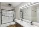 Modern bathroom features double vanity, large mirror and glass enclosed shower with upgraded fixtures at 2847 S Bala Dr, Tempe, AZ 85282