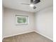 Comfortable bedroom with plush carpeting and a window providing a view of the outdoors at 2847 S Bala Dr, Tempe, AZ 85282