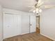 Bedroom featuring neutral carpet, closet and a door leading to another room at 2847 S Bala Dr, Tempe, AZ 85282