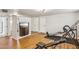 Spacious home gym features hardwood flooring, entertainment center, and exercise equipment at 2847 S Bala Dr, Tempe, AZ 85282