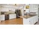 This open-concept kitchen offers stainless steel appliances, ample storage space, granite countertops, and easy access to the dining area at 2847 S Bala Dr, Tempe, AZ 85282