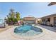 Backyard pool features a slide waterfall, a shaded lounge area and an outdoor bar at 2847 S Bala Dr, Tempe, AZ 85282
