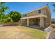 Inviting view of the backyard and covered patio from the exterior of the home at 2920 E Virginia E St, Mesa, AZ 85213