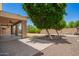 Enjoyable backyard with covered patio, mature trees, and desert landscaping at 2920 E Virginia E St, Mesa, AZ 85213