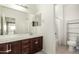 Bathroom with dual sinks and a separate area for the toilet and tub at 2920 E Virginia E St, Mesa, AZ 85213