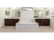 Bathroom with a soaking tub and dual vanities with quartz countertops at 2920 E Virginia E St, Mesa, AZ 85213