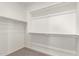 Walk-in closet with carpeted floors, metal rods and shelving at 2920 E Virginia E St, Mesa, AZ 85213
