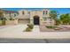 Stunning two-story home featuring a neutral stucco exterior and well-manicured landscaping at 2920 E Virginia E St, Mesa, AZ 85213