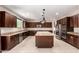 Gourmet kitchen featuring stainless steel appliances, granite countertops, and a center island at 2920 E Virginia E St, Mesa, AZ 85213