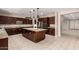 Well-appointed kitchen with granite countertops, a central island, and stainless steel appliances at 2920 E Virginia E St, Mesa, AZ 85213