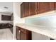 Well-lit kitchen featuring custom cabinets, granite countertops, and mosaic tile backsplash at 2920 E Virginia E St, Mesa, AZ 85213