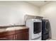 Well-equipped laundry room with modern washer and dryer and adjacent sink at 2920 E Virginia E St, Mesa, AZ 85213