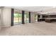 Spacious living area with large sliding doors leading to the backyard and an adjacent kitchen at 2920 E Virginia E St, Mesa, AZ 85213