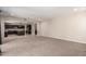 Open-concept living room with a view of the kitchen, dark wood cabinets, and ample space at 2920 E Virginia E St, Mesa, AZ 85213
