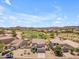 Aerial view of a beautiful home with a private pool overlooking a golf course at 29368 N Red Finch Dr, San Tan Valley, AZ 85143