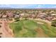 Stunning community golf course providing a green space with views of mountains and residential homes in the neighborhood at 29368 N Red Finch Dr, San Tan Valley, AZ 85143
