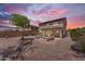 Backyard patio with gravel landscaping featuring comfortable seating, beautiful trees and a privacy wall at 29368 N Red Finch Dr, San Tan Valley, AZ 85143