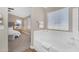 Bright bathroom connected to the main bedroom shows a soaking tub and large window at 29368 N Red Finch Dr, San Tan Valley, AZ 85143