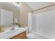 Clean bathroom features a shower and tub combo, wood-look floors, and a single sink vanity at 29368 N Red Finch Dr, San Tan Valley, AZ 85143