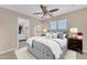 This bedroom has an ensuite and neutral colors, providing a relaxing retreat at 29368 N Red Finch Dr, San Tan Valley, AZ 85143