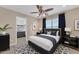 This bedroom features neutral walls, complemented by navy accents and plenty of natural light at 29368 N Red Finch Dr, San Tan Valley, AZ 85143