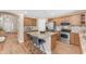 Modern kitchen with stainless steel appliances, center island, and wooden cabinetry at 29368 N Red Finch Dr, San Tan Valley, AZ 85143