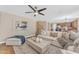 Comfortable living room featuring a stylish sofa and an open concept layout at 29368 N Red Finch Dr, San Tan Valley, AZ 85143