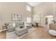 Bright, open-concept living and dining area with high ceilings and hardwood floors at 29368 N Red Finch Dr, San Tan Valley, AZ 85143
