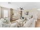 Comfortable living room with a modern ceiling fan, built-in shelving, and a neutral color palette at 29368 N Red Finch Dr, San Tan Valley, AZ 85143