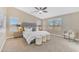 Spacious main bedroom featuring carpet, natural light, a ceiling fan, and stylish decor at 29368 N Red Finch Dr, San Tan Valley, AZ 85143