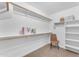 Well-organized walk-in closet with shelves, clothes racks, and ample storage space at 29368 N Red Finch Dr, San Tan Valley, AZ 85143