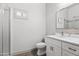 Bright bathroom featuring a glass-enclosed shower, modern vanity, and stylish tile accents at 295 N Rural Rd # 133, Chandler, AZ 85226