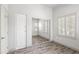 Bright bedroom with a closet and plank flooring at 295 N Rural Rd # 133, Chandler, AZ 85226