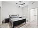 Cozy bedroom with a ceiling fan, neutral walls, and plank flooring at 295 N Rural Rd # 133, Chandler, AZ 85226