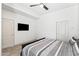 Bedroom with plank flooring, neutral walls, and modern lighting at 295 N Rural Rd # 133, Chandler, AZ 85226