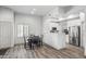 Cozy dining area showcases a modern table with adjacent kitchen views and hardwood floors at 295 N Rural Rd # 133, Chandler, AZ 85226