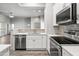 Modern kitchen featuring stainless steel appliances, white countertops, and ample cabinetry at 295 N Rural Rd # 133, Chandler, AZ 85226