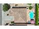 Aerial view of the property featuring a tiled roof, sparkling pool, and lush landscaping at 3088 E Andre Ave, Gilbert, AZ 85298