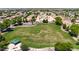 Aerial view of a community park with a green lawn, trees, and a covered picnic area at 3088 E Andre Ave, Gilbert, AZ 85298