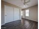Bedroom with large closet and window and wood-look flooring at 3088 E Andre Ave, Gilbert, AZ 85298