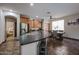 Open kitchen featuring a large island with bar seating, stainless steel appliances, and adjacent dining area at 3088 E Andre Ave, Gilbert, AZ 85298