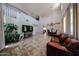 Expansive living area with high ceilings and a view into dining room, creating a grand and inviting atmosphere at 3088 E Andre Ave, Gilbert, AZ 85298