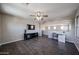 Bright living room with an adjacent office space featuring modern furnishings and a comfortable setup at 3088 E Andre Ave, Gilbert, AZ 85298