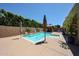 Beautiful backyard pool surrounded by lush landscaping and a charming gazebo at 3088 E Andre Ave, Gilbert, AZ 85298