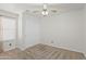 Cozy bedroom with a ceiling fan and a closet with sliding doors at 3114 E Kristal Way, Phoenix, AZ 85050
